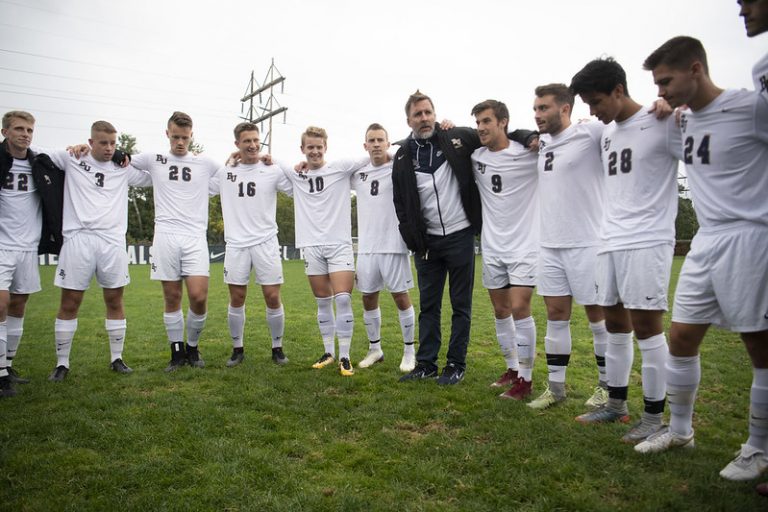 Soccer coach and team